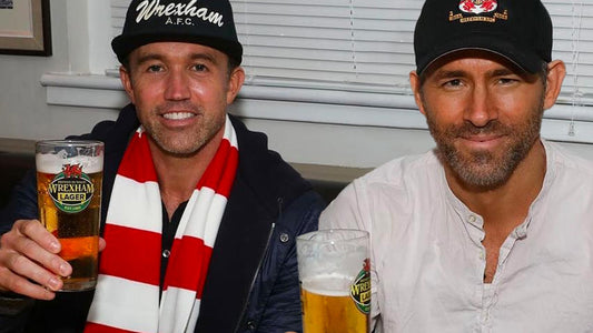 Ryan Reynolds and Rob McElhenney drinking Wrexham Lager