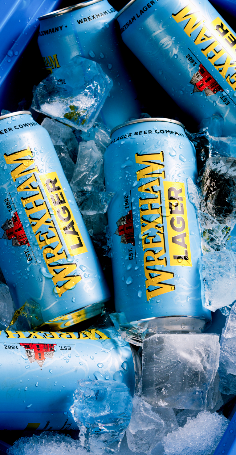 Wrexham Lager cans in a cooler with ice