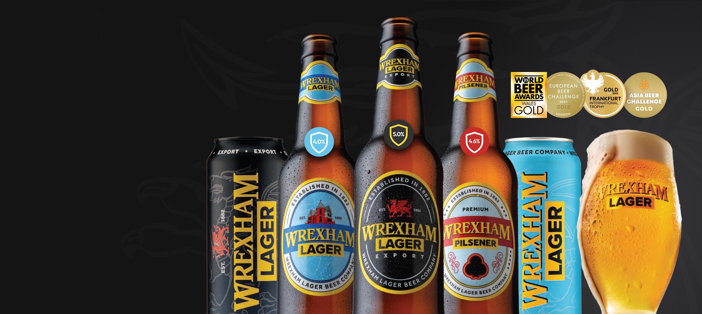 Wrexham Lager bottles and a can on a dark background with gold awards.